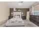 A large main bedroom featuring decoratively appointed shelves and a chandelier at 51 N Rush St, Chandler, AZ 85226
