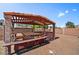 A covered outdoor seating area provides shade and comfort in the backyard at 5401 N 104Th Dr, Glendale, AZ 85307