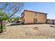 Backyard of a two-story home with desert landscaping and space for outdoor activities at 5401 N 104Th Dr, Glendale, AZ 85307