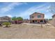 Large backyard with a covered patio area, brick and block fence for privacy at 5401 N 104Th Dr, Glendale, AZ 85307