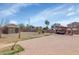 Backyard boasts a brick patio, storage shed, and ample space for outdoor activities at 5401 N 104Th Dr, Glendale, AZ 85307
