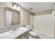 Well-lit bathroom featuring a shower-tub combo, single sink with vanity, and tile flooring at 5401 N 104Th Dr, Glendale, AZ 85307