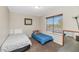 Bedroom featuring twin beds, carpet, natural light and neutral paint at 5401 N 104Th Dr, Glendale, AZ 85307