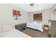 Bedroom with twin beds, closet, carpet, neutral paint, and a ceiling fan at 5401 N 104Th Dr, Glendale, AZ 85307