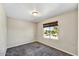 Cozy bedroom with soft carpet, neutral walls, and a window providing natural light at 5401 N 104Th Dr, Glendale, AZ 85307