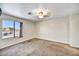 Spacious bedroom with neutral walls, soft carpet and a window offering natural light at 5401 N 104Th Dr, Glendale, AZ 85307