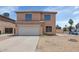 Two-story home showcasing a neutral color palette, tiled roof, and a two-car garage at 5401 N 104Th Dr, Glendale, AZ 85307
