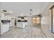 Bright, open kitchen with an island, modern appliances, and tile floors at 5401 N 104Th Dr, Glendale, AZ 85307