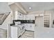 Kitchen shows white cabinets, modern countertops, white appliances, and gray backsplash at 5401 N 104Th Dr, Glendale, AZ 85307