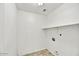 Functional laundry room with tile flooring and hookups for washer and dryer at 5401 N 104Th Dr, Glendale, AZ 85307