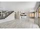 Open-concept living space featuring tile floors and kitchen access at 5401 N 104Th Dr, Glendale, AZ 85307