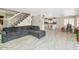 Spacious living room with tile flooring flows into the kitchen area with an open layout at 5401 N 104Th Dr, Glendale, AZ 85307