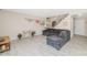 Open-concept living room featuring tile floors, neutral walls, and staircase to the upper level at 5401 N 104Th Dr, Glendale, AZ 85307