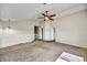 Upstairs loft featuring carpet flooring, natural light, and a ceiling fan at 5401 N 104Th Dr, Glendale, AZ 85307