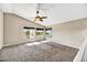 Upstairs loft featuring carpet flooring, natural light, and a ceiling fan at 5401 N 104Th Dr, Glendale, AZ 85307