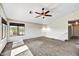Upstairs loft features a ceiling fan, carpet flooring, and natural light at 5401 N 104Th Dr, Glendale, AZ 85307