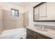 Functional bathroom with shower-tub combo, granite countertop, and mirrored cabinet at 5415 E Butte St, Mesa, AZ 85205