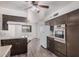 This kitchen boasts stainless steel appliances, a breakfast bar, laminate counters and updated cabinets at 5415 E Butte St, Mesa, AZ 85205
