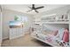 Bright bedroom with bunk beds, a ceiling fan, and a dresser with a TV at 5614 N 20Th Dr, Phoenix, AZ 85015