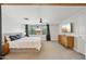Bright primary bedroom with a large window, ceiling fan, dresser, and modern decor at 5614 N 20Th Dr, Phoenix, AZ 85015