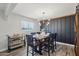 Dining room with rustic wood table, modern light fixture, and stylish decor at 5614 N 20Th Dr, Phoenix, AZ 85015