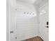 Clean entryway with shiplap accent wall and convenient hooks, providing a welcoming and organized space for guests at 5614 N 20Th Dr, Phoenix, AZ 85015