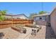 Backyard garden featuring raised garden beds, brick pavers, and a peaceful outdoor space at 5614 N 20Th Dr, Phoenix, AZ 85015