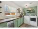 Well-equipped laundry room featuring a wine cooler, storage, and modern washer and dryer at 5614 N 20Th Dr, Phoenix, AZ 85015