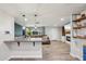 Open floor plan connecting a kitchen island with the dining and living area at 5614 N 20Th Dr, Phoenix, AZ 85015