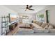 Comfortable living room with a spacious sectional sofa, large window, and stylish decor, perfect for entertaining at 5614 N 20Th Dr, Phoenix, AZ 85015