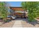 Outdoor kitchen features built-in grills, seating, and a stylish pergola, ideal for entertaining at 5614 N 20Th Dr, Phoenix, AZ 85015