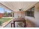 Covered patio with an outdoor dining table, ceiling fan, and access to the backyard at 5614 N 20Th Dr, Phoenix, AZ 85015