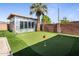 Backyard bonus room with putting green, showcasing outdoor recreation in a modern backyard at 6802 E Oak St, Scottsdale, AZ 85257