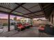 Backyard with pool, spa, built-in grill and covered patio at dusk at 6802 E Oak St, Scottsdale, AZ 85257