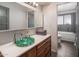 Bathroom with a unique green glass bowl sink and integrated shower at 6802 E Oak St, Scottsdale, AZ 85257