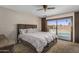 Cozy bedroom with large bed, sliding glass doors to the backyard and neutral decor at 6802 E Oak St, Scottsdale, AZ 85257