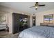 Well-lit bedroom with large bed and built-in shelving and entertainment center at 6802 E Oak St, Scottsdale, AZ 85257