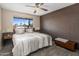 Bedroom with a brick accent wall and view of the neighborhood at 6802 E Oak St, Scottsdale, AZ 85257