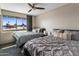 Bedroom featuring two beds and a large window at 6802 E Oak St, Scottsdale, AZ 85257