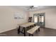 Dining room with tile flooring, views of backyard and vintage arcade game at 6802 E Oak St, Scottsdale, AZ 85257