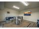 Bright game room with entertainment seating, table and chairs, and large flatscreen TV at 6802 E Oak St, Scottsdale, AZ 85257