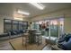 Well-lit game room with entertainment seating, bar table, and view of the pool outside at 6802 E Oak St, Scottsdale, AZ 85257