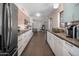 Modern kitchen with white cabinetry and stainless steel appliances at 6802 E Oak St, Scottsdale, AZ 85257