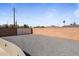 Large graveled side yard with brick wall that provides privacy and secure parking at 6802 E Oak St, Scottsdale, AZ 85257