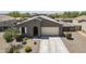 Aerial view of home, driveway, and desert landscaping at 7261 E Teal Way, San Tan Valley, AZ 85143