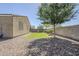 Side view of backyard featuring lawn and block wall for privacy at 7261 E Teal Way, San Tan Valley, AZ 85143
