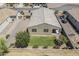 Well maintained backyard featuring gravel landscaping, lush grass, and private block fence at 7261 E Teal Way, San Tan Valley, AZ 85143