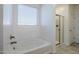Bright bathroom featuring a tub and glass shower at 7261 E Teal Way, San Tan Valley, AZ 85143