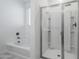 Bright bathroom featuring a tub and glass shower at 7261 E Teal Way, San Tan Valley, AZ 85143