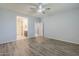 A spacious bedroom with vinyl floors and connections to a bathroom at 7261 E Teal Way, San Tan Valley, AZ 85143